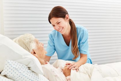 Hospice nurse treating a patient